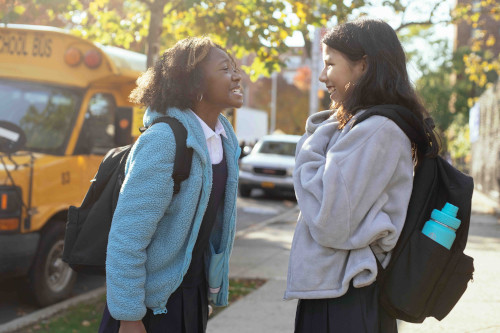 Two school children laughing